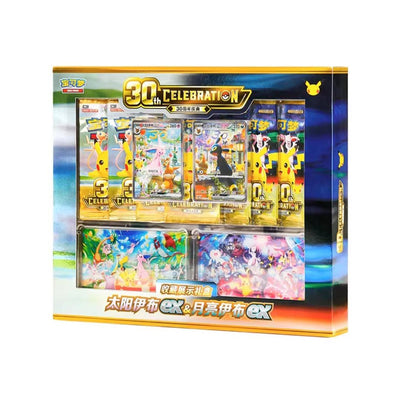 Caja premium Pokémon 30 aniversario con sobres, cartas promocionales de Umbreon y Espeon y diseño dorado coleccionable.