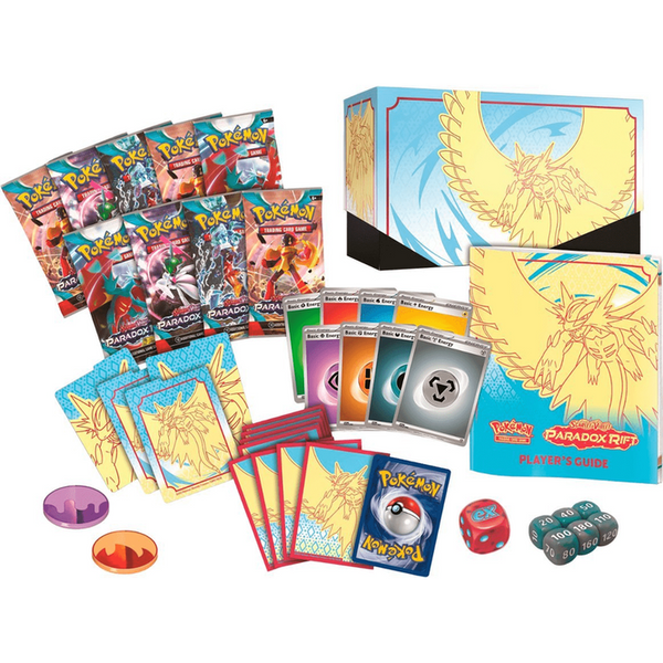 Caja de Entrenador Élite Pokémon Brecha Paradójica con sobres, fundas, guía, dados y accesorios de juego coleccionables.